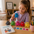 Plush emotion monsters set on a wooden table with a child playing, used for calm emotional check-ins and screen-free connection, with a subtle USFERA book in the background