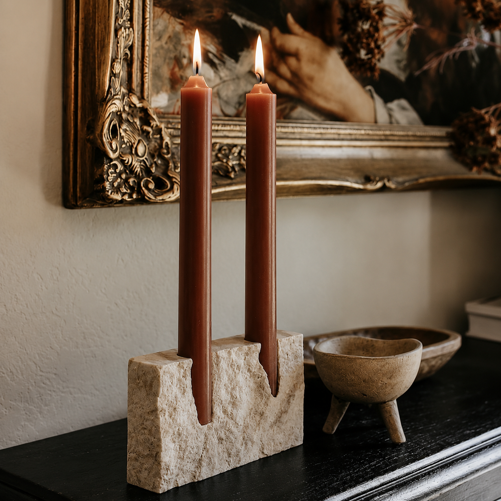 Beige travertine candle holder styled in a calm luxury family living room with USFERA branding on a separate object