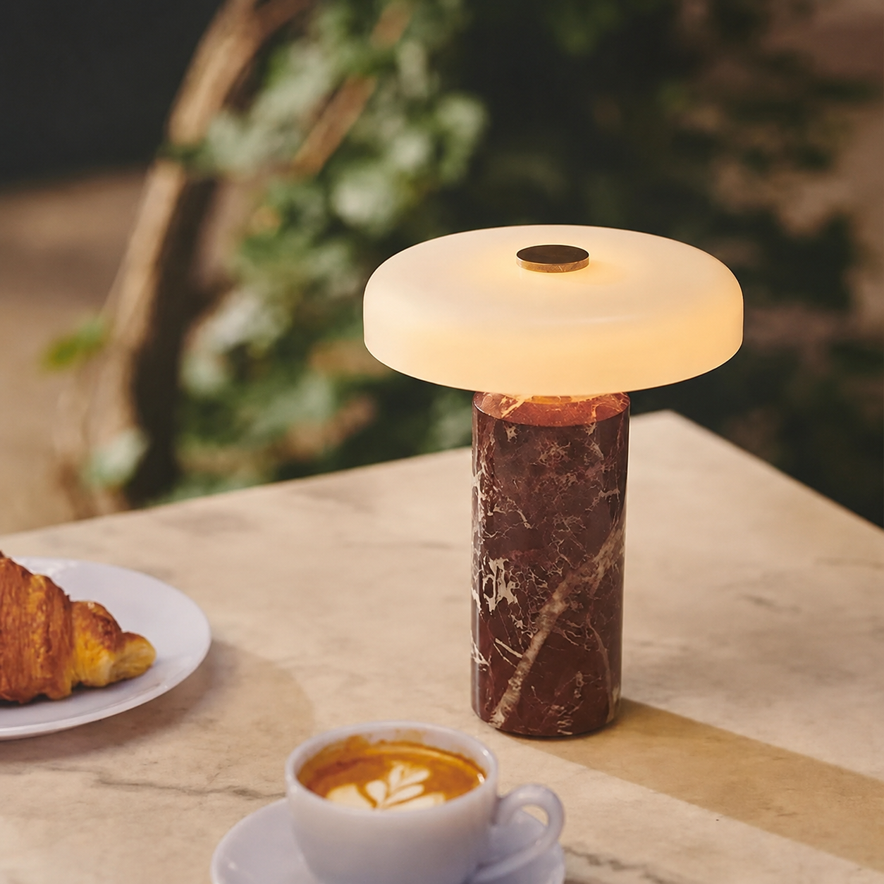 Rechargeable marble-style table lamp for a beige calm bedroom interior