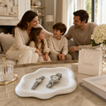 White ceramic jewelry tray with organic cloud shape for rings, watches, and small accessories