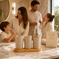 Ceramic bathroom accessory set styled on a marble vanity in a luxury family bathroom with USFERA branding on a separate bag