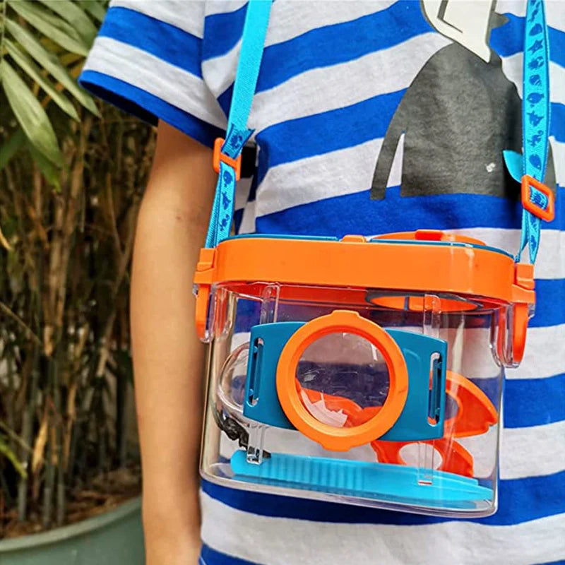 Child carrying a bug catcher kit during outdoor play