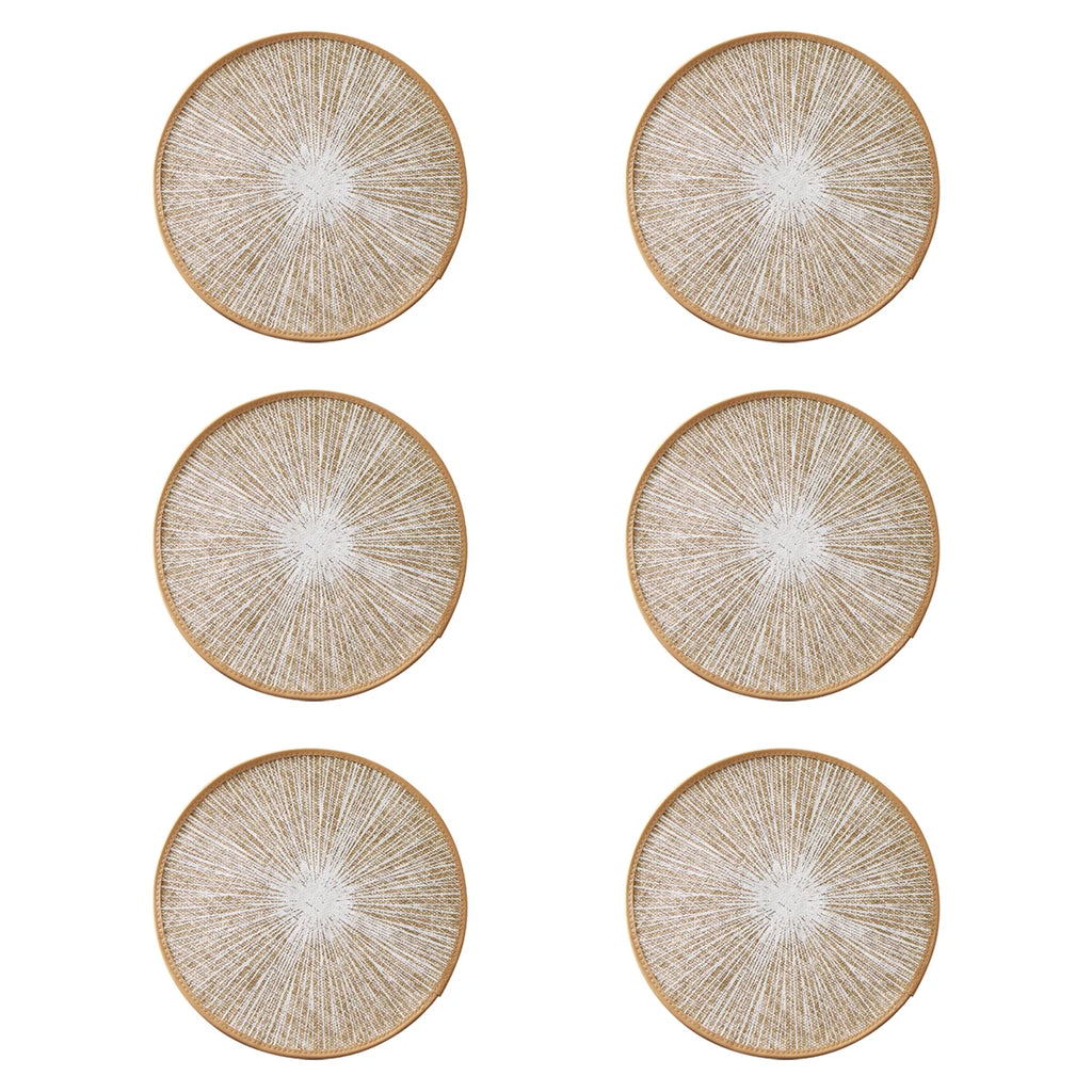Round burlap macrame placemats styled on a light wood dining table