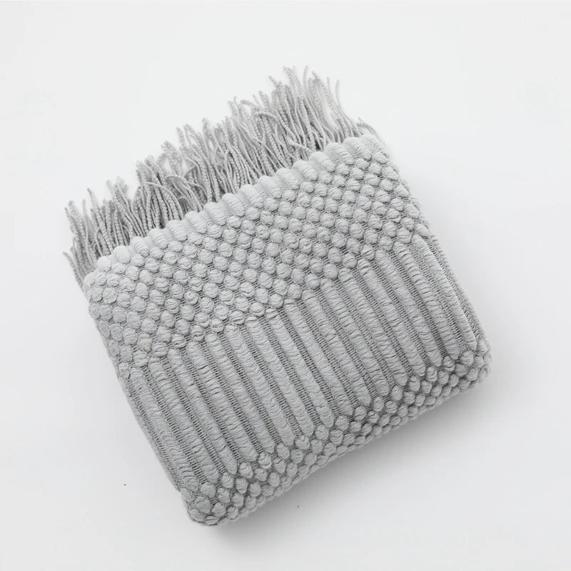 Premium neutral throw blanket with soft knitted pattern, designed for calm home decor and everyday family comfort.