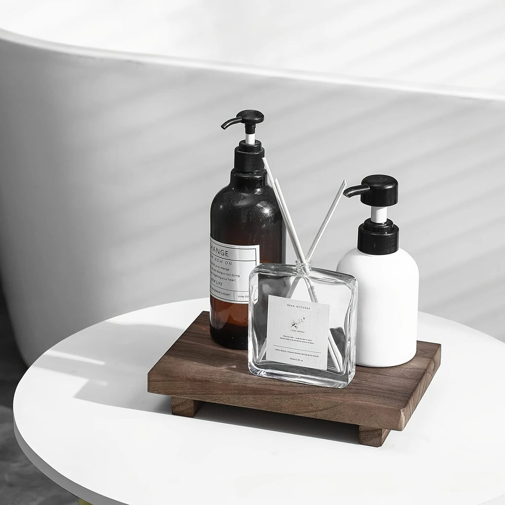 Luxury bathroom vanity scene with wooden pedestal tray warm lighting and neutral decor