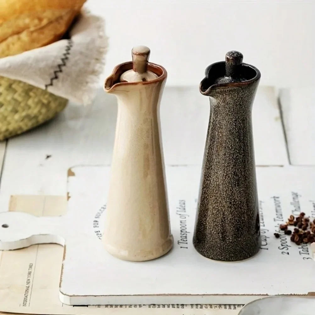 minimalist ceramic oil dispenser used during cooking in warm family kitchen