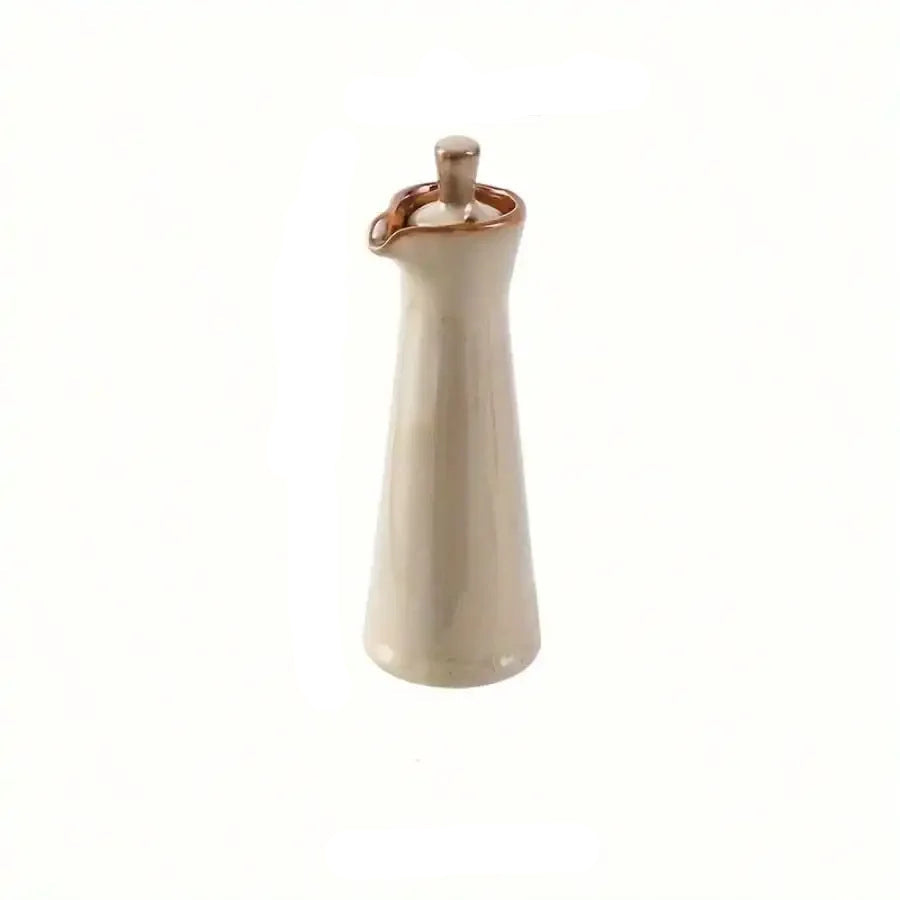 natural ceramic oil bottles with wooden tray in organized clutter free kitchen