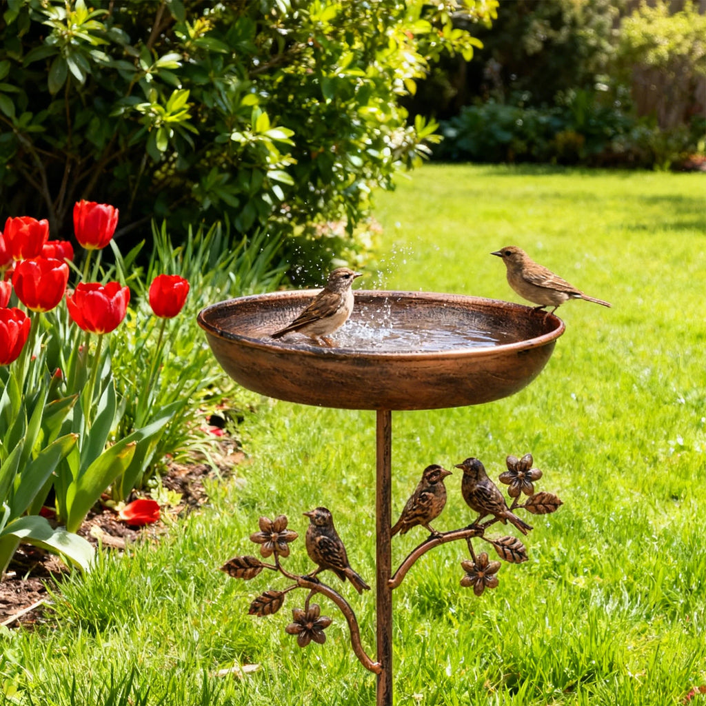 Standing metal bird bath for garden patio and backyard decor with vintage bronze finish and outdoor floral styling