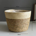 Family styling a natural woven planter basket with greenery on an outdoor patio table for calm luxury garden living