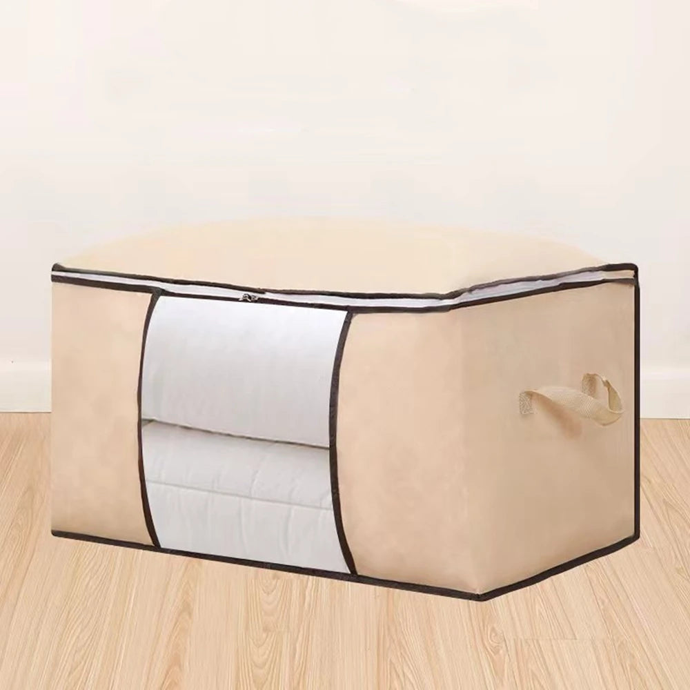 Open fabric storage container with folded blankets and bedding, styled in a warm minimalist bedroom for clutter-free home organization.
