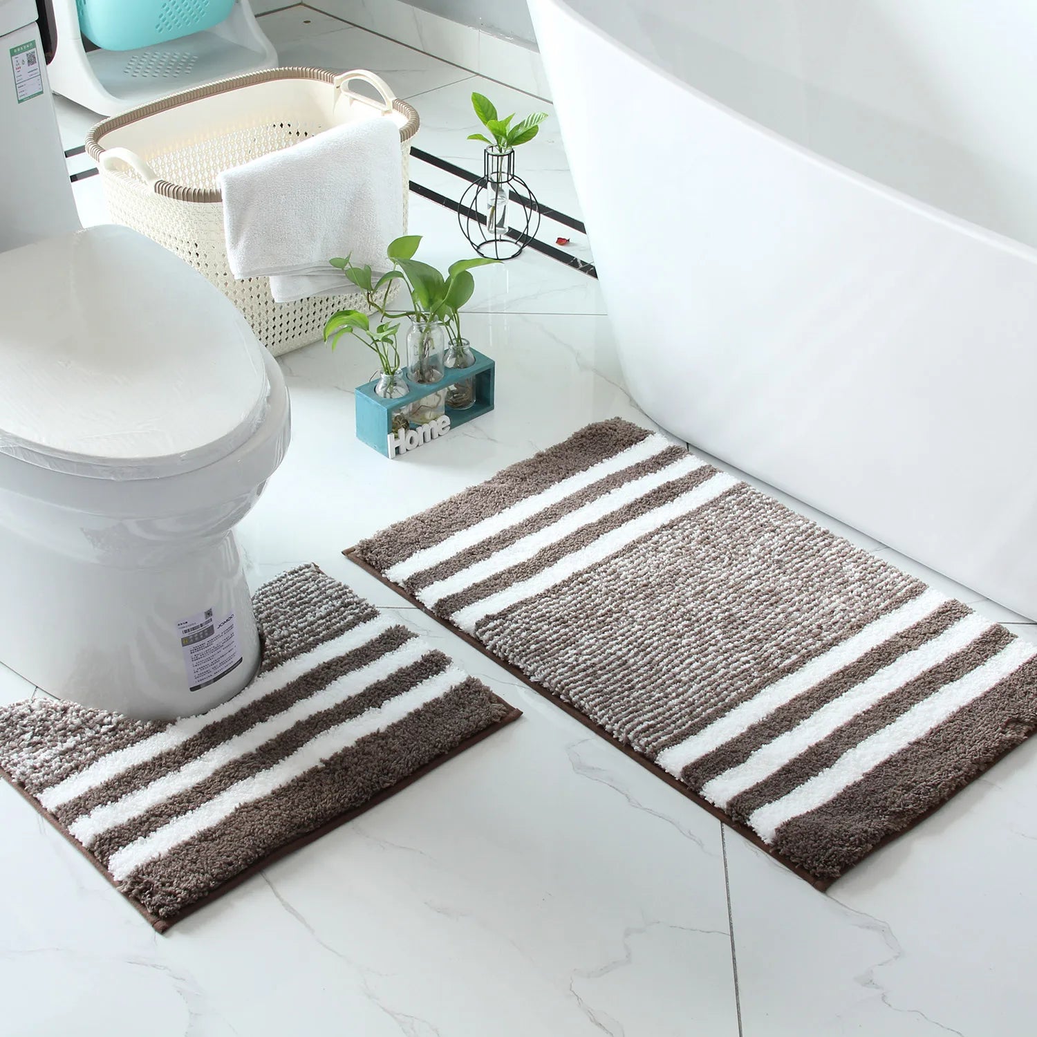 Beige and grey striped bath mats for calmer daily bathroom routines