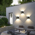 Modern outdoor wall light with warm white glow on exterior patio wall for calm evening outdoor living