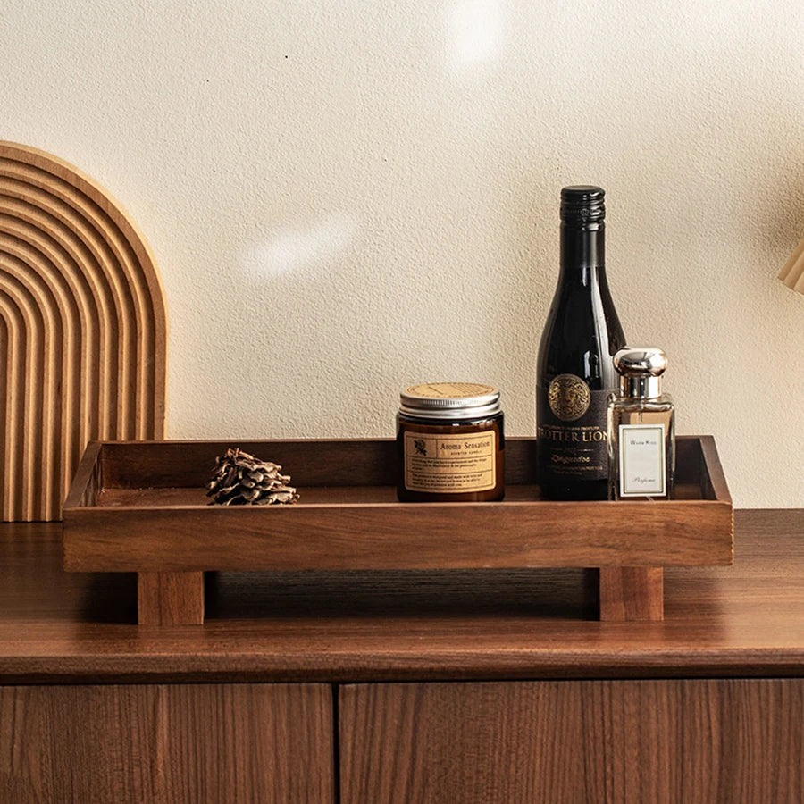 minimal wooden tray on coffee table with book, cup and soft neutral decor in a calm home setting
