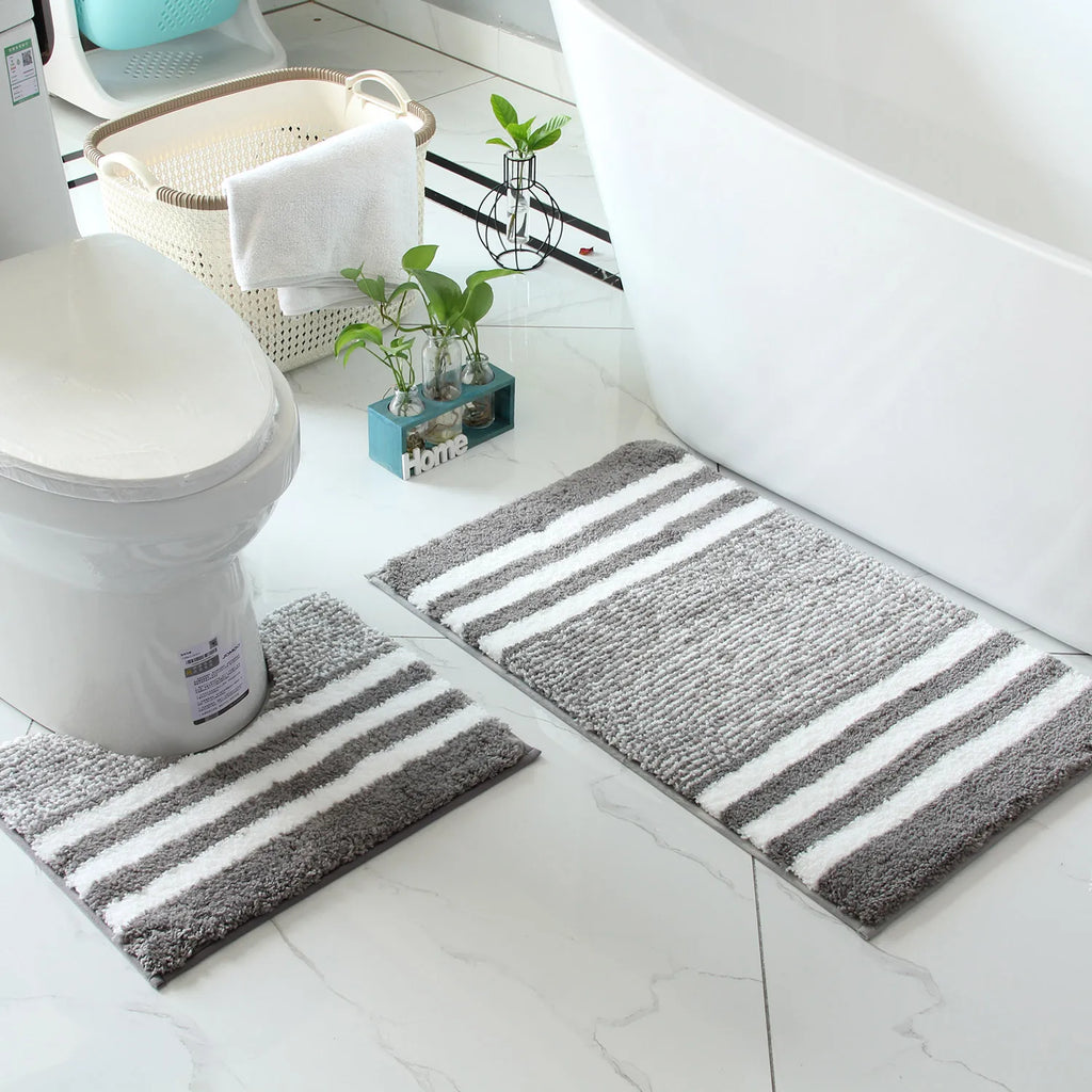 Beige and grey striped bath mats for calmer daily bathroom routines