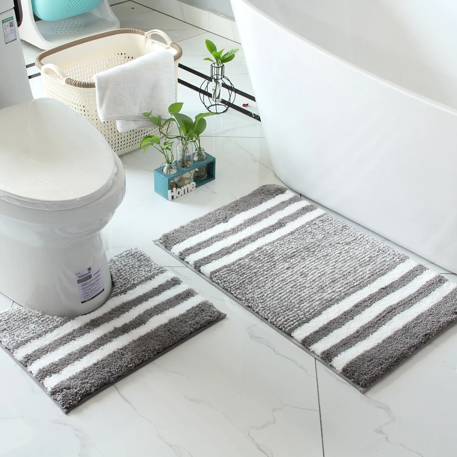 Beige and grey striped bath mats for calmer daily bathroom routines