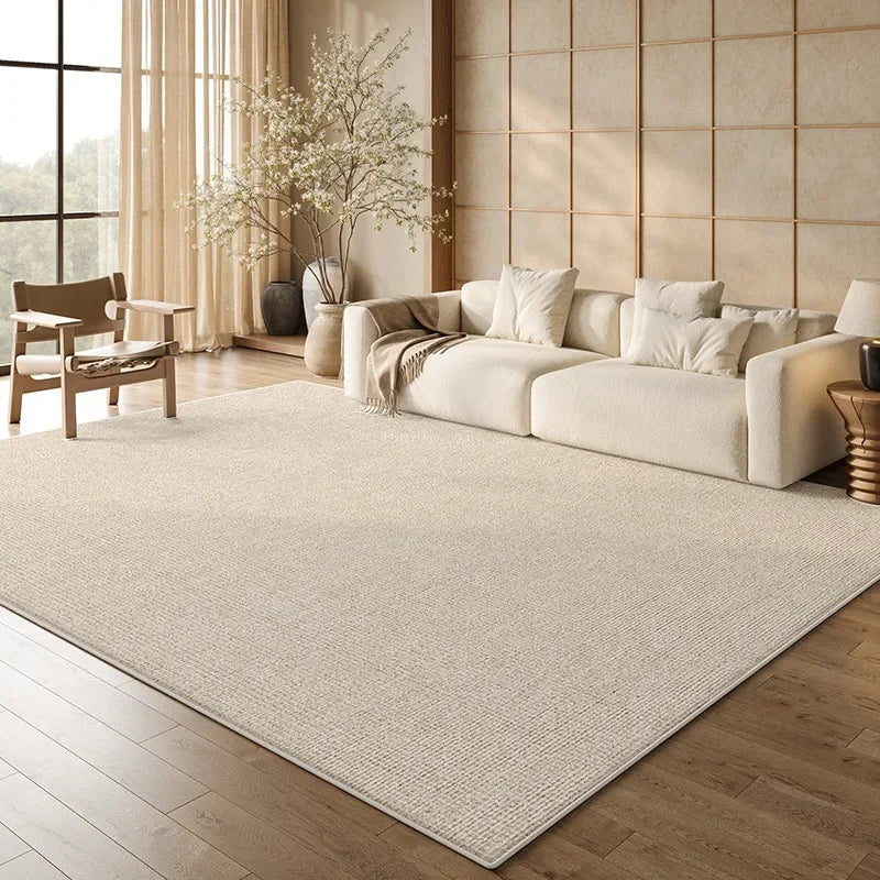 Large beige living room rug in an elegant calm-home interior with marble coffee table and refined luxury styling