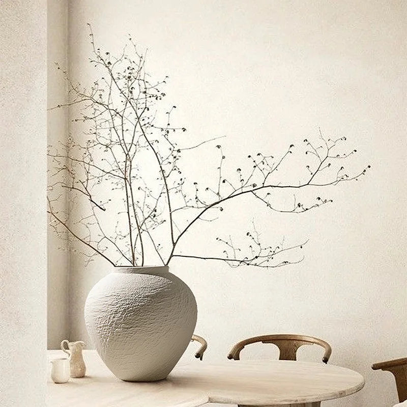 wabi sabi ceramic vases with textured finish styled in warm beige minimalist home decor