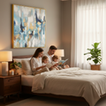 Abstract teal blue gold canvas wall art in gold frame above king size bed with family reading together in cozy premium bedroom
